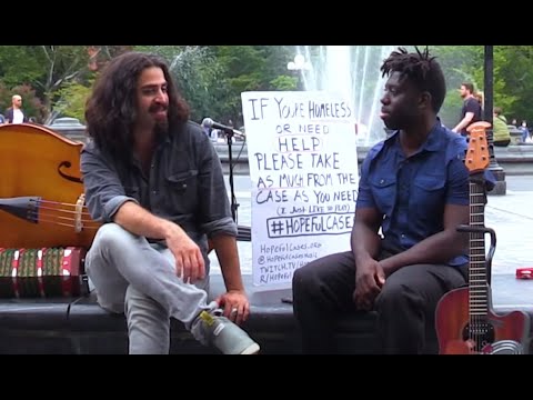 This street performer gives money instead of taking it